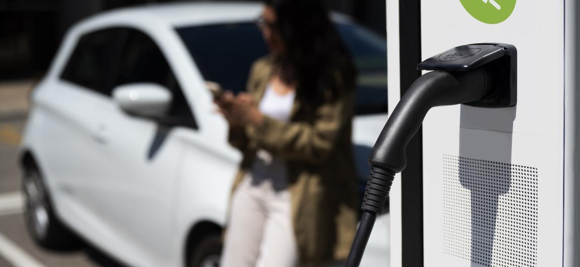 side view blurry woman waiting near car